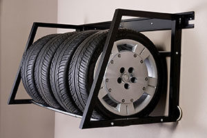 Wall mounted tire racks store your tires off the ground.