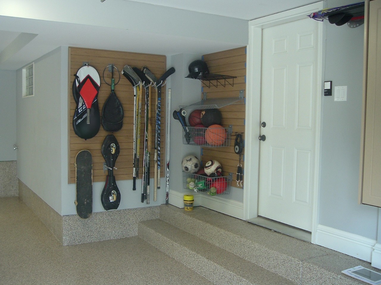 Use SlatWall Panels & SlatWall Accessories to Organize kids' toys and sports equipment