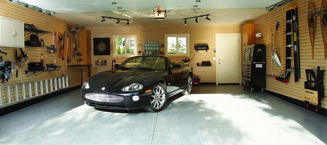 Garage makeover with slatwall panels added to all walls for ultimate storage solution.