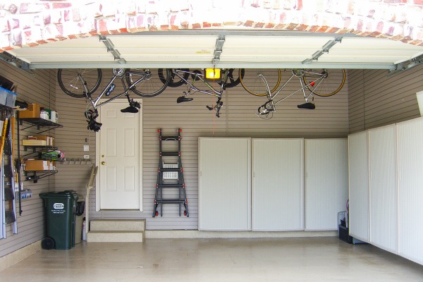 Additional storage created by adding slatwall panels to garage walls.