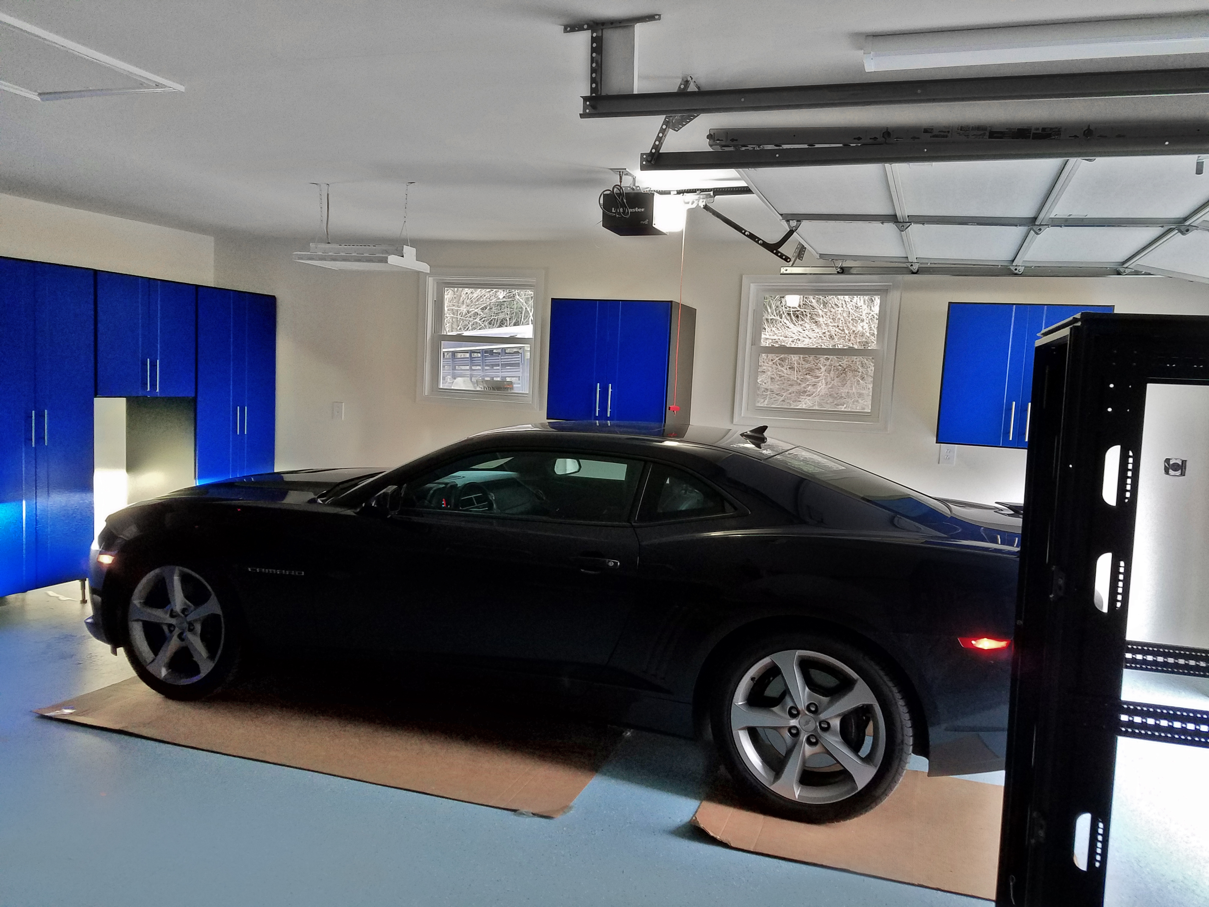 A mix of different cabinet sizes solved this garage storage problem.