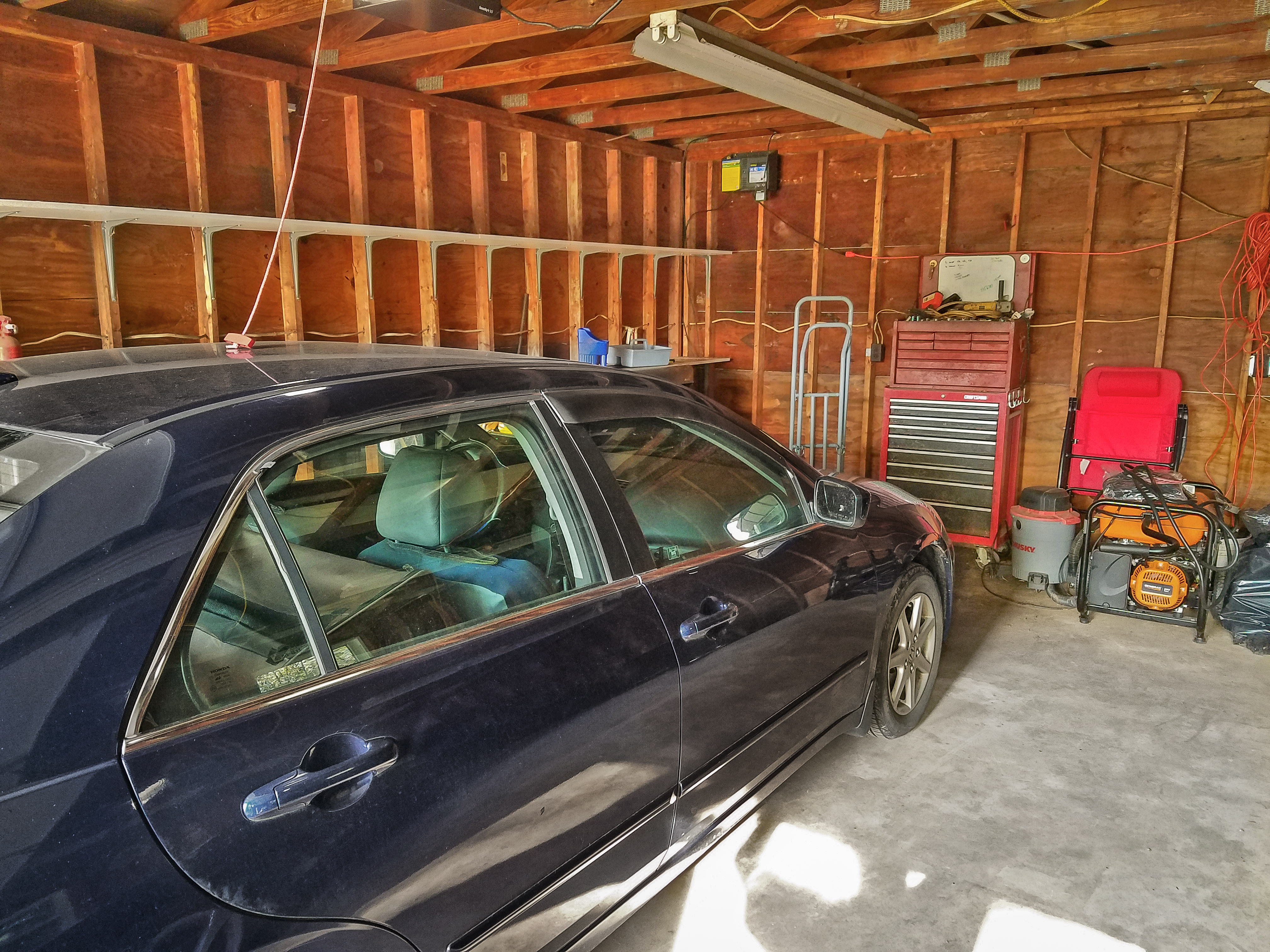 Unused wall space gave us lots of opportunity for garage storage solutions.