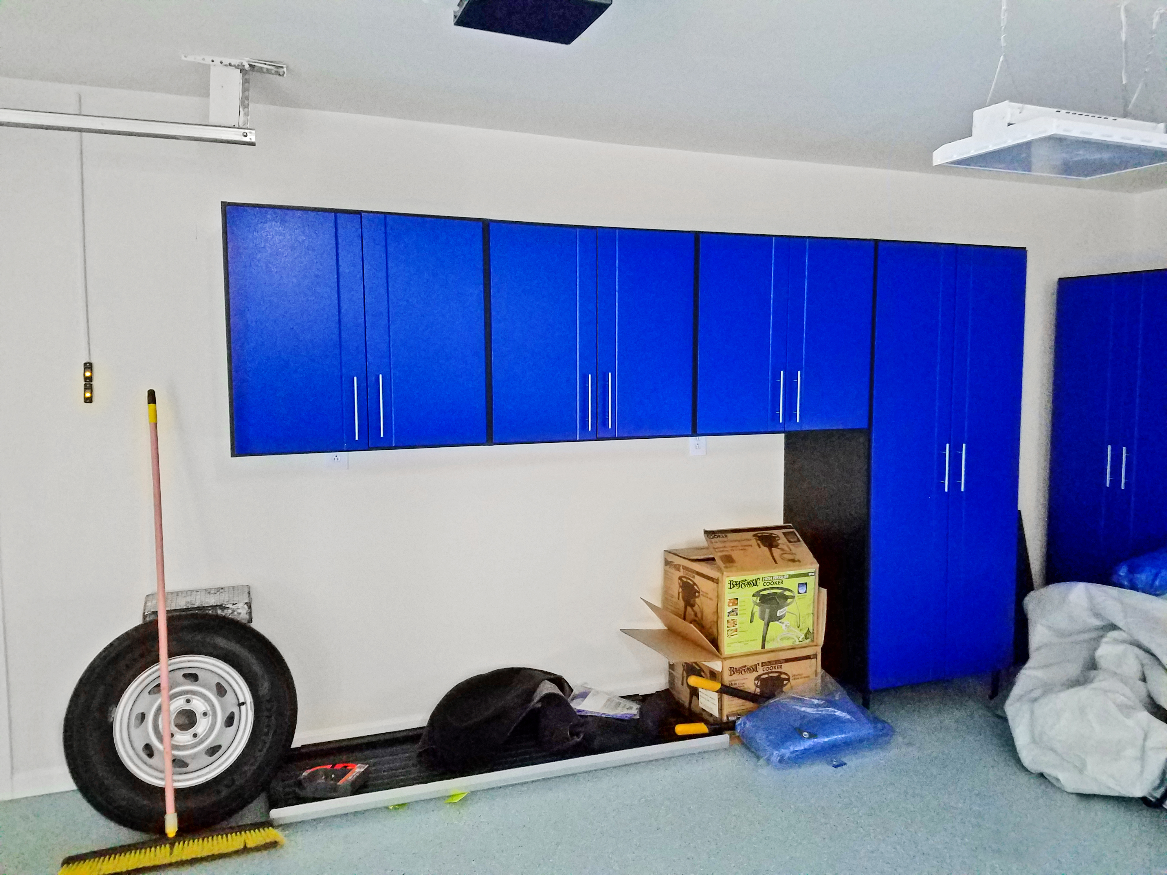Workspace garage cabinets were custom built for Karen B.